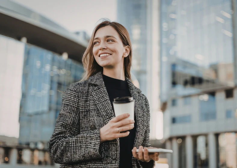 Smiling woman with coffee